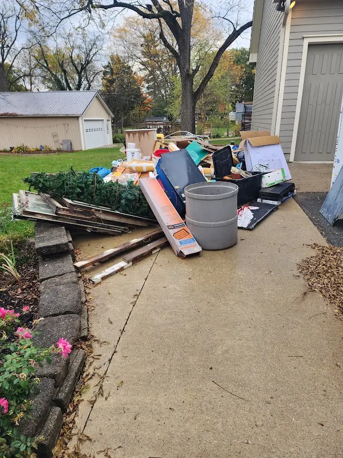 Dumpster being loaded with debris for 30 Yard Dumpster Rental in Litchfield